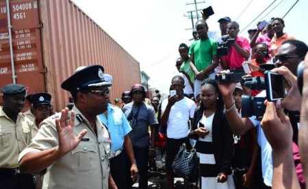 Officials address anxious relatives outside Guyana’s main prison in Georgetown