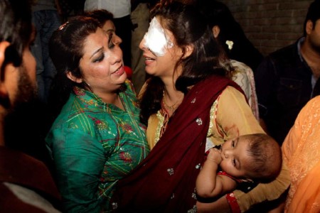 A mother injured in the bomb blast is comforted at a local hospital in Lahore 