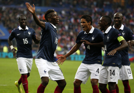 France's Pogba celebrates with team mates after scoring against Portugal during their friendly