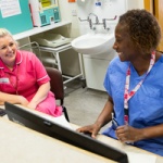 nurses-chatting-at-reception-desk