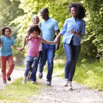 Multi Generation African American Family On Country Walk