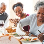 Family eating together at holiday table