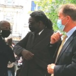 NHSFig 7 After-the-service Lord Adebowale in a covid handshake with Professor Chris Imafidon