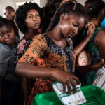 2022-06-29-woman-casts-ballot-nigeria