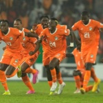 Ivory Coast players celebrate after defeating Senegal in a penalty shootout