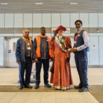 TfL Image – An actress from Zoom through History dressed as Suffragette leader, Emmeline Pankhurst with staff at Barking Riverside station